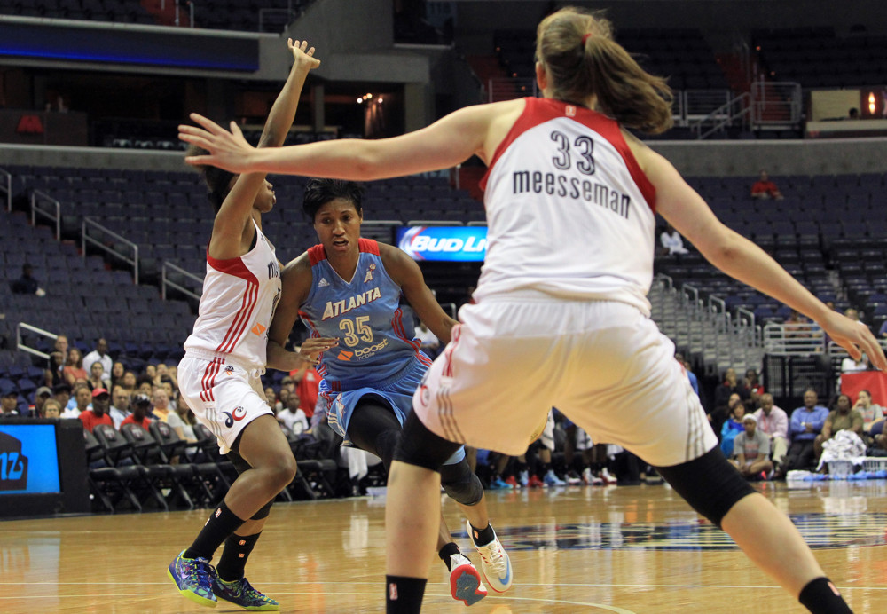 June 12 2015: Tayler Hill (4) and Emma Meesseman (33) of the Washington Mystics defend against Angel McCoughtry (35) of the Atlanta Dream during a WNBA game at Verizon Center, in Washington D.C.
Dream won 64-61