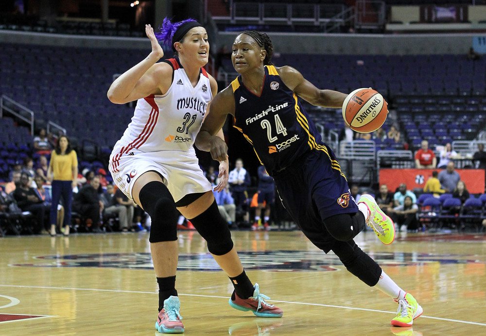 August 11 2015:  Indiana Fever forward Tamika Catchings (24) bursts past Washington Mystics center Stefanie Dolson (31) during a WNBA game at Verizon Center, in Washington D.C.
Indiana won 73-62