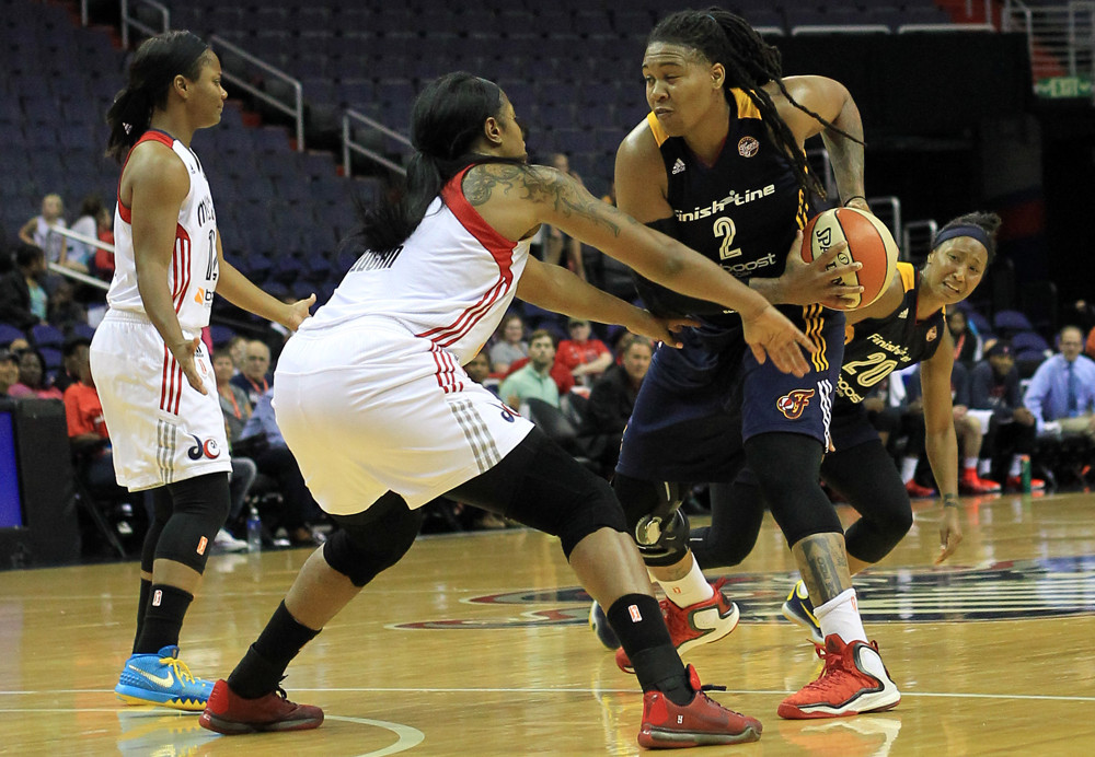 August 11 2015:  Washington Mystics center Kia Vaughn (9) defends against Indiana Fever forward Erlana Larkins (2) during a WNBA game at Verizon Center, in Washington D.C.
Indiana won 73-62